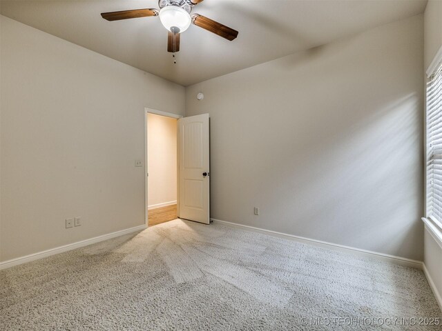 16321 E 48th Pl, Tulsa, OK 74134 - spare room featuring a ceiling fan, light colored carpet, and baseboards