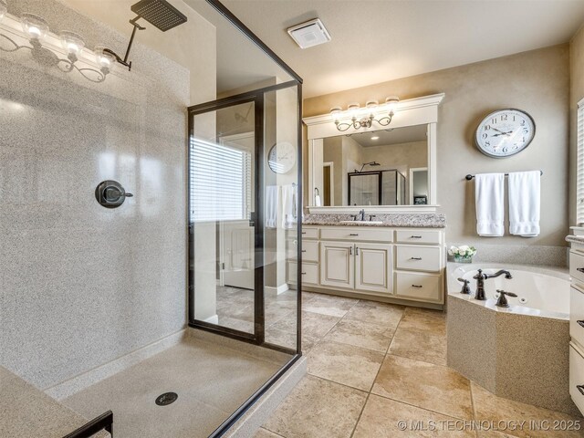 16321 E 48th Pl, Tulsa, OK 74134 - full bath with a jetted tub, a stall shower, tile patterned flooring, and vanity