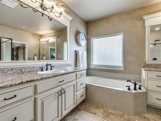 16321 E 48th Pl, Tulsa, OK 74134 - full bathroom featuring a bath, visible vents, and vanity
