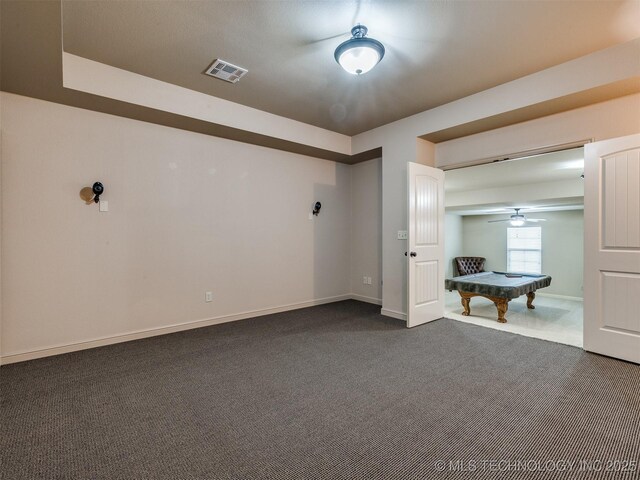 16321 E 48th Pl, Tulsa, OK 74134 - spare room with dark carpet, visible vents, baseboards, billiards, and a ceiling fan