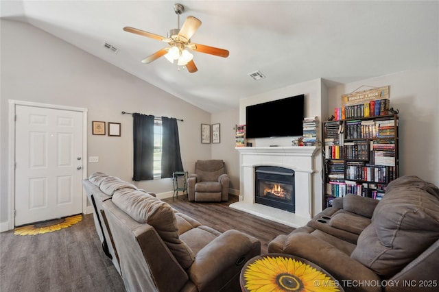 11213 N 120th E Ave, Owasso, OK 74055 - living room featuring visible vents, vaulted ceiling, ceiling fan, and a glass covered fireplace