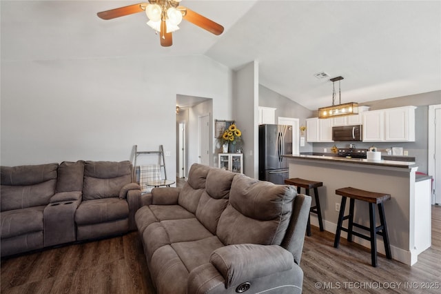 11213 N 120th E Ave, Owasso, OK 74055 - living area with dark wood-type flooring, ceiling fan, high vaulted ceiling, and visible vents