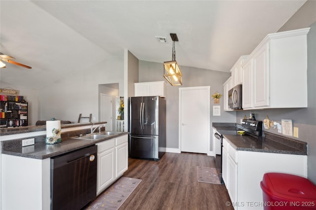 11213 N 120th E Ave, Owasso, OK 74055 - kitchen featuring a sink, visible vents, dark countertops, appliances with stainless steel finishes, and lofted ceiling