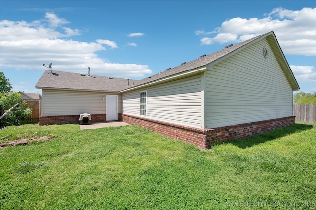 11213 N 120th E Ave, Owasso, OK 74055 - back of property featuring a patio area, brick siding, a lawn, roof with shingles, and fence