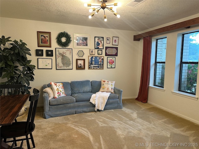 2621 Chuckwa St, Durant, OK 74701 - carpeted living room with a chandelier, a textured ceiling, and baseboards