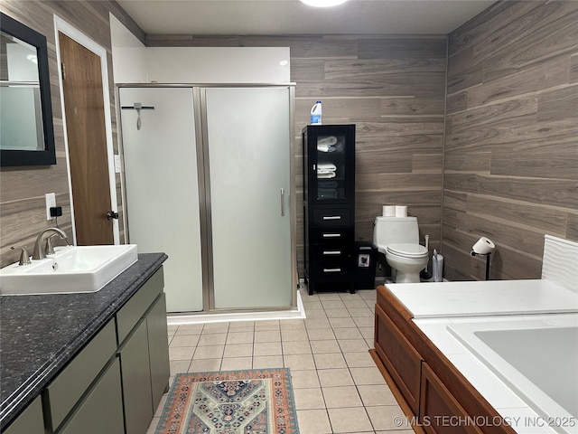 2621 Chuckwa St, Durant, OK 74701 - bathroom with tile patterned flooring, a shower stall, vanity, wood walls, and toilet