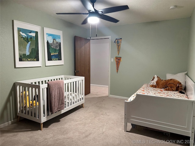 2621 Chuckwa St, Durant, OK 74701 - carpeted bedroom with baseboards and ceiling fan