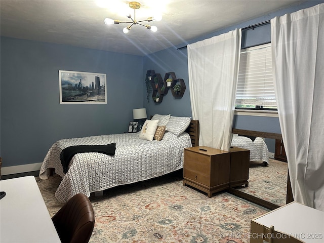 2621 Chuckwa St, Durant, OK 74701 - bedroom featuring a chandelier and baseboards