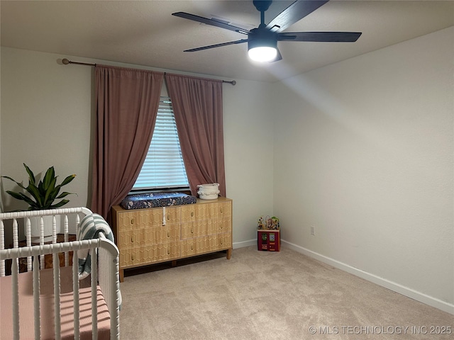 2621 Chuckwa St, Durant, OK 74701 - carpeted bedroom featuring baseboards and a ceiling fan