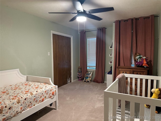 2621 Chuckwa St, Durant, OK 74701 - bedroom with light carpet, ceiling fan, and a textured ceiling