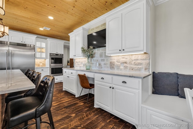 5393 W 184th St S, Mounds, OK 74047 - kitchen featuring dark wood-style floors, appliances with stainless steel finishes, white cabinetry, and wood ceiling