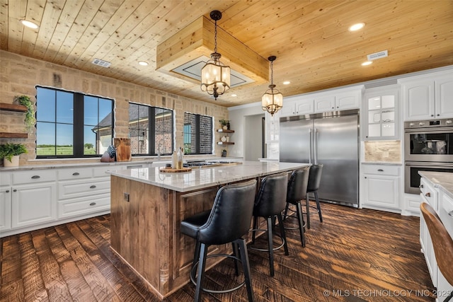 5393 W 184th St S, Mounds, OK 74047 - kitchen featuring appliances with stainless steel finishes, a center island, white cabinets, and wood ceiling