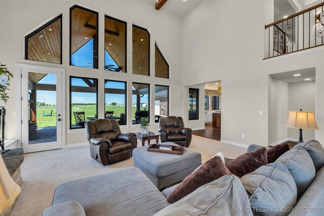 5393 W 184th St S, Mounds, OK 74047 - carpeted living room featuring baseboards, recessed lighting, and a towering ceiling