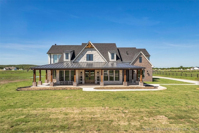 5393 W 184th St S, Mounds, OK 74047 - back of house with a lawn, roof with shingles, and a standing seam roof