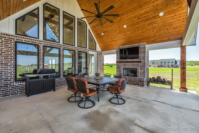 5393 W 184th St S, Mounds, OK 74047 - view of patio / terrace featuring outdoor dining area, a ceiling fan, and an outdoor brick fireplace