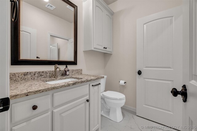 5393 W 184th St S, Mounds, OK 74047 - bathroom with vanity, toilet, marble finish floor, visible vents, and baseboards