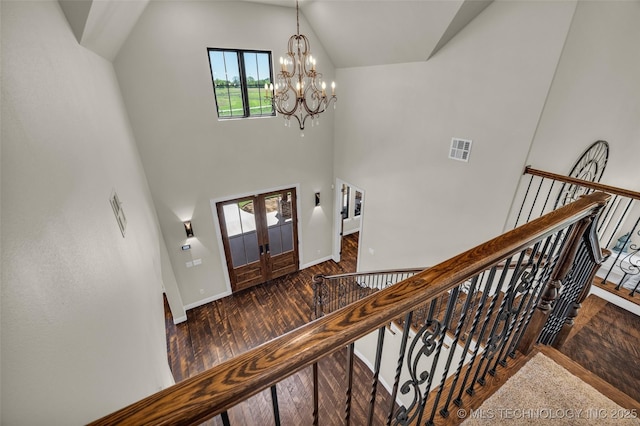 5393 W 184th St S, Mounds, OK 74047 - staircase with wood finished floors, a chandelier, baseboards, visible vents, and high vaulted ceiling