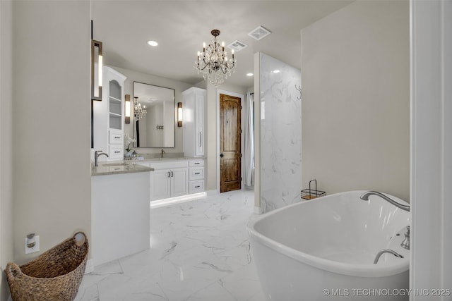 5393 W 184th St S, Mounds, OK 74047 - bathroom featuring a chandelier, recessed lighting, vanity, a freestanding bath, and marble finish floor