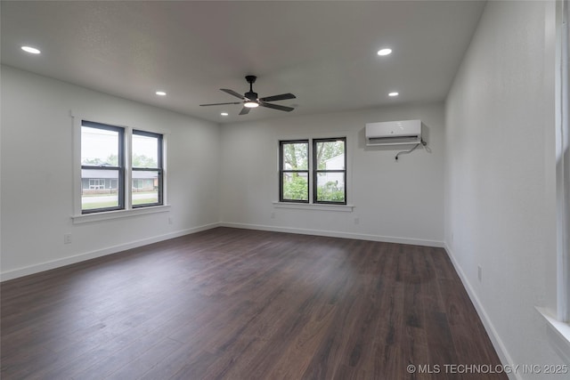 spare room featuring baseboards, a wall mounted air conditioner, ceiling fan, dark wood-type flooring, and recessed lighting