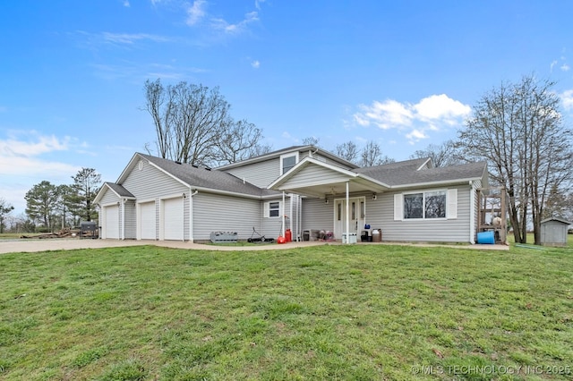 view of front of property featuring a front lawn, concrete driveway, and an attached garage