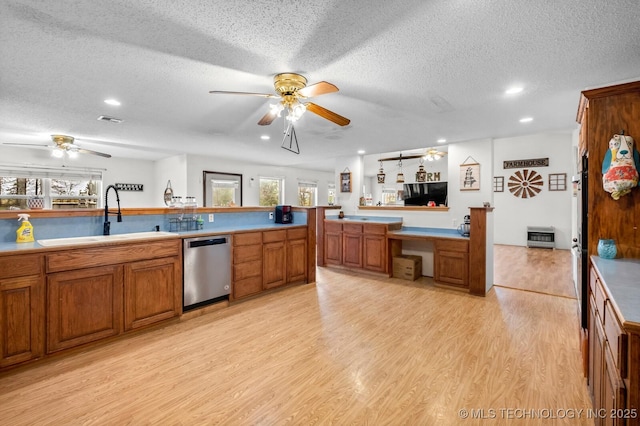 kitchen with ceiling fan, a healthy amount of sunlight, stainless steel dishwasher, and a sink
