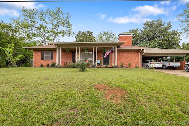 ranch-style home with a front yard, a chimney, brick siding, concrete driveway, and a carport