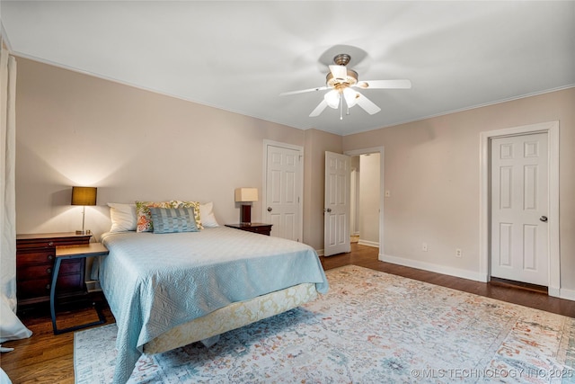 3855 S Utica Ave, Tulsa, OK 74105 - bedroom with wood finished floors, baseboards, a ceiling fan, and ornamental molding