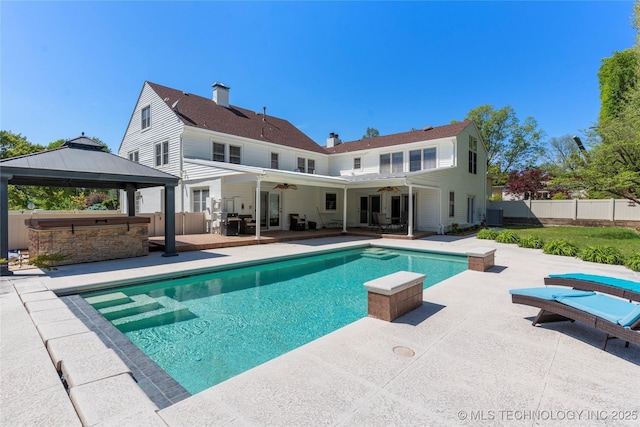 3855 S Utica Ave, Tulsa, OK 74105 - view of pool featuring ceiling fan, a patio, a fenced backyard, and a gazebo
