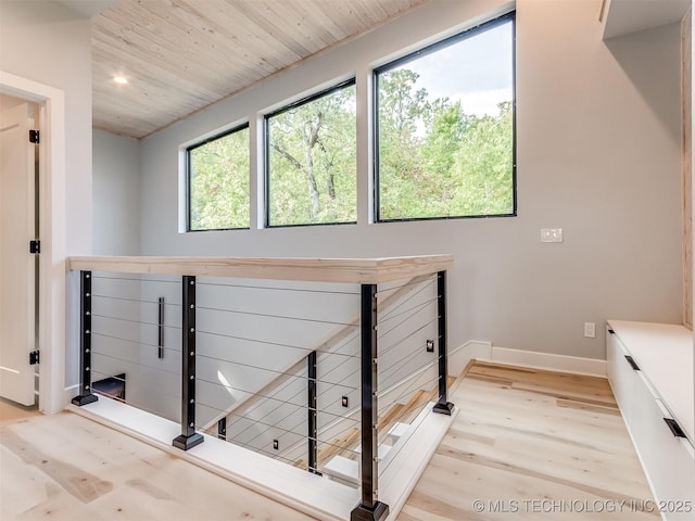 staircase featuring baseboards, recessed lighting, wood finished floors, and wooden ceiling