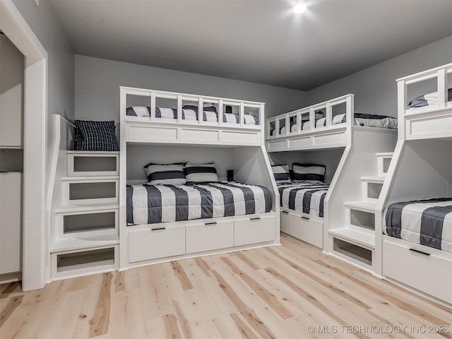 unfurnished bedroom with light wood finished floors