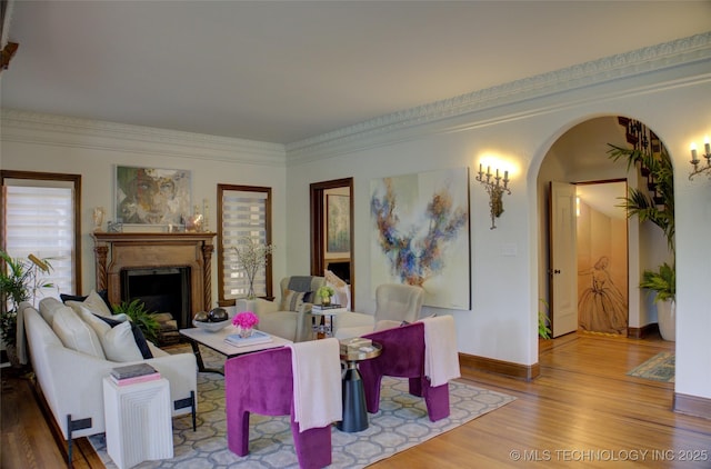 2156 S Owasso Pl, Tulsa, OK 74114 - living area with arched walkways, baseboards, wood finished floors, and a fireplace