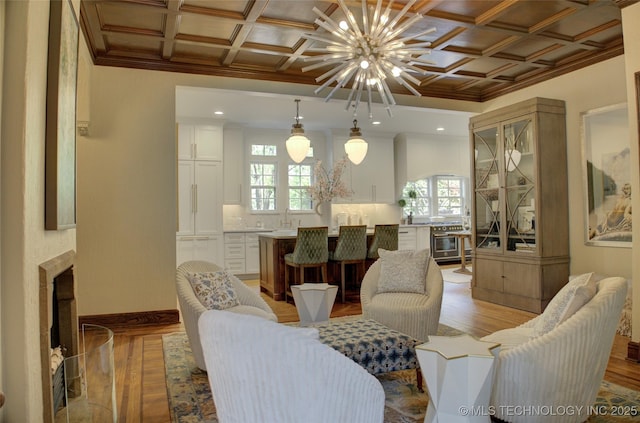 2156 S Owasso Pl, Tulsa, OK 74114 - living area featuring crown molding, a chandelier, light wood finished floors, and coffered ceiling
