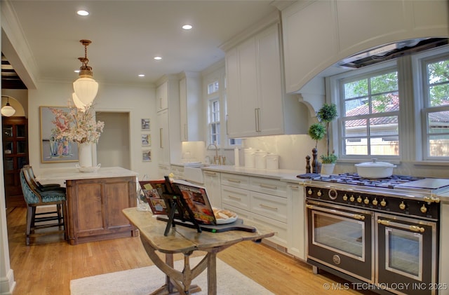 2156 S Owasso Pl, Tulsa, OK 74114 - kitchen with white cabinetry, double oven range, and light wood finished floors