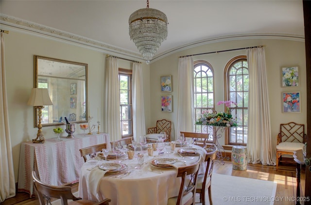 2156 S Owasso Pl, Tulsa, OK 74114 - dining room with wood finished floors and a chandelier