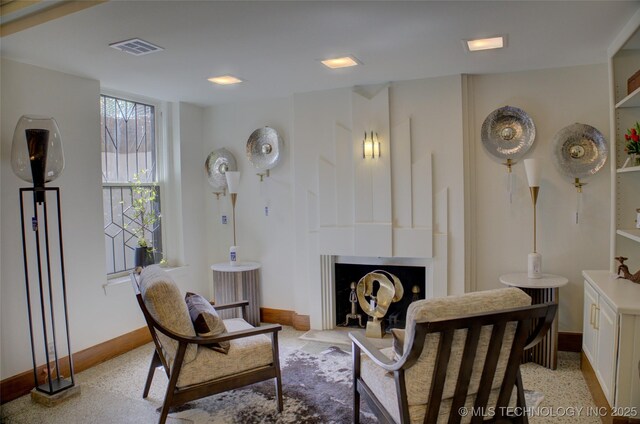 2156 S Owasso Pl, Tulsa, OK 74114 - living area with baseboards, a fireplace, and visible vents