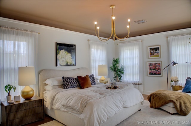 2156 S Owasso Pl, Tulsa, OK 74114 - bedroom featuring visible vents, a chandelier, and multiple windows