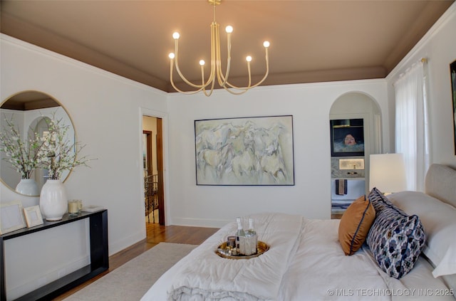 2156 S Owasso Pl, Tulsa, OK 74114 - bedroom with baseboards, arched walkways, wood finished floors, and a notable chandelier