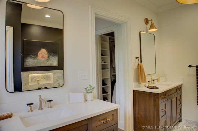 2156 S Owasso Pl, Tulsa, OK 74114 - bathroom with a sink, a spacious closet, crown molding, and two vanities