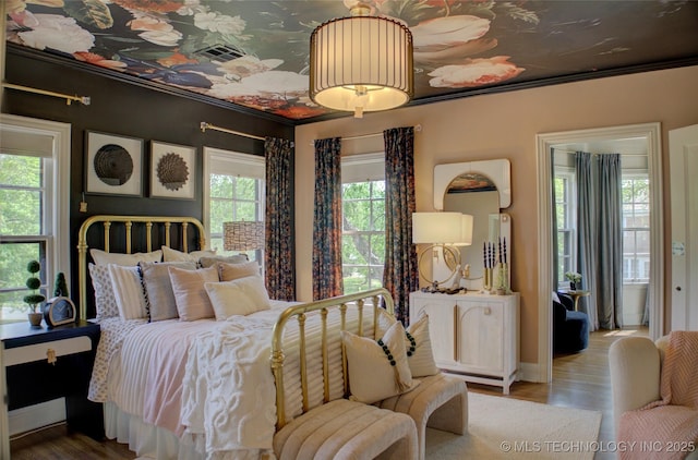 2156 S Owasso Pl, Tulsa, OK 74114 - bedroom with visible vents, baseboards, crown molding, and wood finished floors