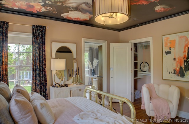 2156 S Owasso Pl, Tulsa, OK 74114 - bedroom featuring ornamental molding and wood finished floors