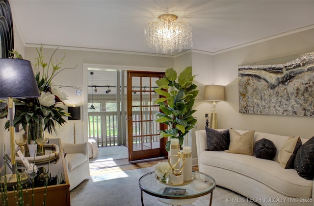 2156 S Owasso Pl, Tulsa, OK 74114 - living room featuring an inviting chandelier and ornamental molding