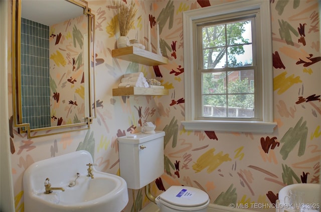2156 S Owasso Pl, Tulsa, OK 74114 - bathroom featuring a sink, toilet, and wallpapered walls