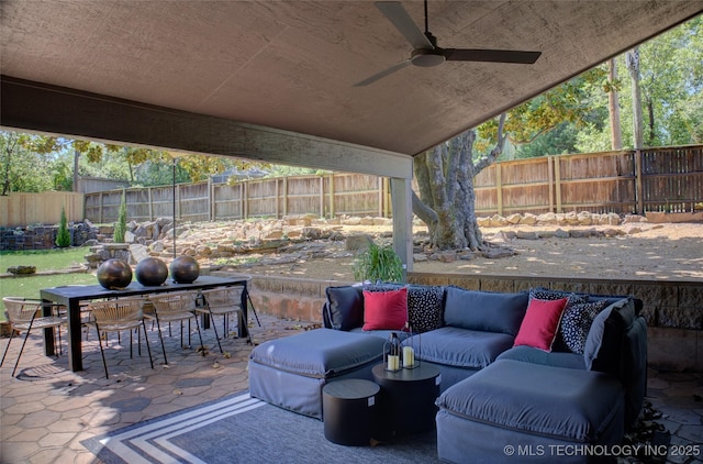 2156 S Owasso Pl, Tulsa, OK 74114 - view of patio featuring outdoor dining area, a ceiling fan, a fenced backyard, and an outdoor hangout area