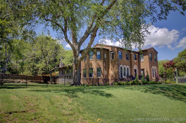 2156 S Owasso Pl, Tulsa, OK 74114 - view of front of property with brick siding, a front lawn, and fence