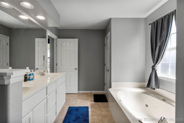 full bathroom with a sink, tile patterned floors, double vanity, recessed lighting, and a tub with jets
