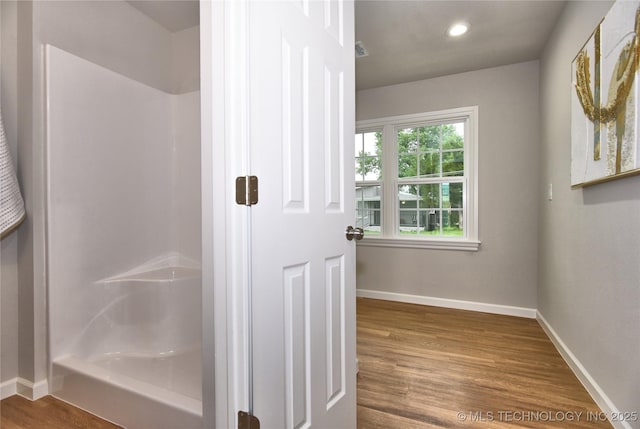 543 N Ridgeway St, Sapulpa, OK 74066 - bathroom with baseboards, wood finished floors, a shower, and recessed lighting