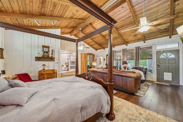 bedroom featuring lofted ceiling with beams, hardwood / wood-style floors, and wood ceiling