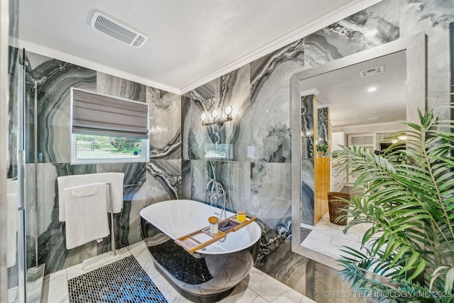 bathroom with visible vents, a freestanding bath, crown molding, and marble finish floor