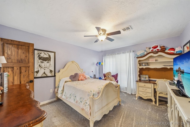 bedroom with visible vents, ceiling fan, and carpet