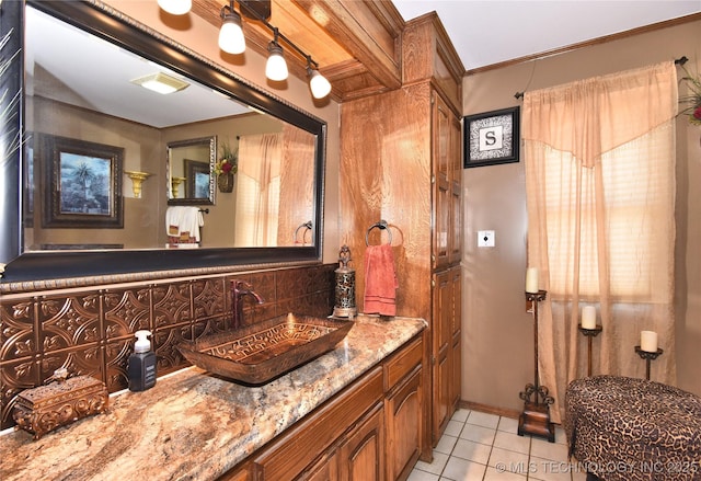 3001 Bacon Rd, Muskogee, OK 74403 - bathroom with ornamental molding, vanity, backsplash, and tile patterned floors